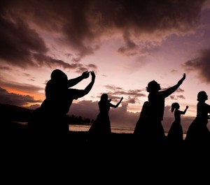 Adult hula class practicing at the beach